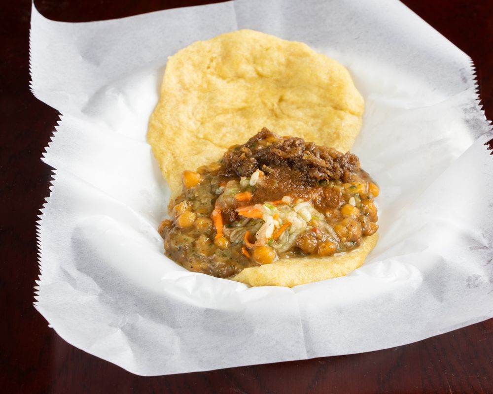 Doubles — bara with curried channa, slaw and pepper sauce